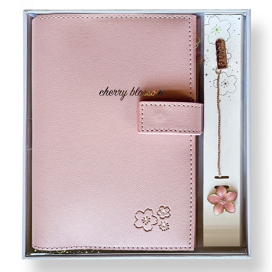 SAKURA journal for girls in trendy fashion colors with high-quality paper, compact design, button flap, brass floral bookmark, and gift box packaging. Victoria's Journals. Pink