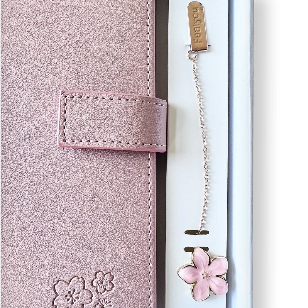 SAKURA journal for girls in trendy fashion colors with high-quality paper, compact design, button flap, brass floral bookmark, and gift box packaging. Victoria's Journals. Pink Green