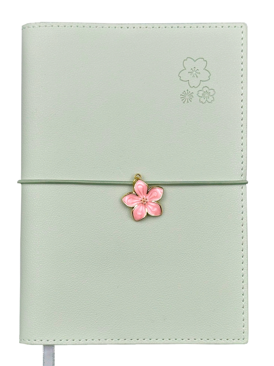 SAKURA journal for girls in stylish fashion colors, high-quality paper, compact and easy to carry, with elastic band and brass floral pendant. By Victoria's Journals.