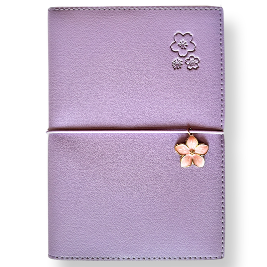 SAKURA journal for girls in stylish fashion colors, high-quality paper, compact and easy to carry, with elastic band and brass floral pendant. By Victoria's Journals. Lilac