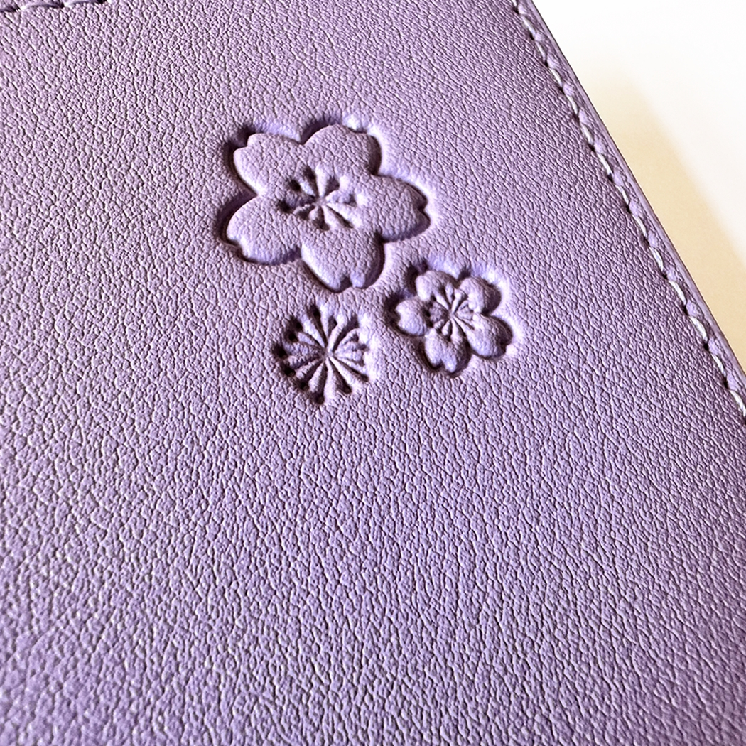 SAKURA journal for girls in stylish fashion colors, high-quality paper, compact and easy to carry, with elastic band and brass floral pendant. By Victoria's Journals. Lilac