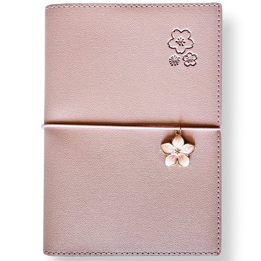 SAKURA journal for girls in stylish fashion colors, high-quality paper, compact and easy to carry, with elastic band and brass floral pendant. By Victoria's Journals. Pink